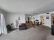 Inviting living room with a mirrored wall, dining table, and views to kitchen at 5155 9Th N Ave # 206 B, St Petersburg, FL 33710