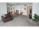 Bright living area featuring a mirrored wall, dining table, and comfortable seating at 5155 9Th N Ave # 206 B, St Petersburg, FL 33710