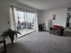Bright living space featuring large glass sliding doors to balcony and comfortable seating at 5155 9Th N Ave # 206 B, St Petersburg, FL 33710