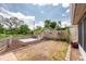Spacious back yard featuring a fenced perimeter, a concrete patio, and partial xeriscaping at 5675 Lown N St, St Petersburg, FL 33714