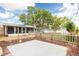 Large backyard with a shed, mature shade trees, and wood privacy fence at 5675 Lown N St, St Petersburg, FL 33714