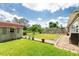 The large backyard includes a shed, green grass, and mature landscaping at 5675 Lown N St, St Petersburg, FL 33714