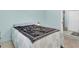 Comfortable bedroom with a queen bed and an adjacent bathroom with tile flooring at 5675 Lown N St, St Petersburg, FL 33714