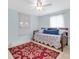 Guest bedroom featuring tile flooring, a daybed, and a bright window at 5675 Lown N St, St Petersburg, FL 33714