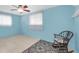 Spacious room with two windows, light-blue walls and tile floors, with a ceiling fan at 5675 Lown N St, St Petersburg, FL 33714