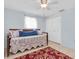 Guest bedroom featuring tile flooring, a daybed, and a large closet at 5675 Lown N St, St Petersburg, FL 33714
