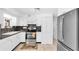 Well-maintained kitchen with stainless steel appliances, granite countertops, and white cabinets at 5675 Lown N St, St Petersburg, FL 33714