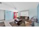 Inviting living room with neutral walls, comfortable sofa, and tile flooring at 5675 Lown N St, St Petersburg, FL 33714
