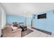 Inviting living room with neutral walls, comfortable sofa, and tile flooring at 5675 Lown N St, St Petersburg, FL 33714