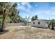 Fenced backyard with mature trees at 6014 S 82Nd St, Tampa, FL 33619