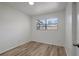 Bright bedroom with wood-look floors and a window at 6014 S 82Nd St, Tampa, FL 33619