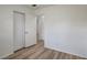 A light and airy bedroom with modern wood-look flooring and neutral paint at 6014 S 82Nd St, Tampa, FL 33619