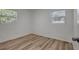 Cozy bedroom with hardwood floors, two windows offering natural light at 6014 S 82Nd St, Tampa, FL 33619