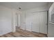Bedroom featuring wood floors, closet, and natural lighting at 6014 S 82Nd St, Tampa, FL 33619