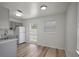Clean and updated kitchen with modern appliances, gray cabinets, and sleek countertops, open to the dining area at 6014 S 82Nd St, Tampa, FL 33619