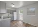 Bright kitchen with new stainless steel appliances, updated cabinetry, and hardwood floors for a modern touch at 6014 S 82Nd St, Tampa, FL 33619