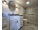 Bathroom features a modern vanity, granite countertops, and a tiled walk-in shower at 6060 Shore S Blvd # 903, Gulfport, FL 33707