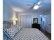 Cozy bedroom featuring wood-look floors, ample closet space, and a stylish bed with decorative pillows at 6060 Shore S Blvd # 903, Gulfport, FL 33707