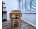 Dining area showcases wood floors, shutter style window blinds, and a decorative shelf at 6060 Shore S Blvd # 903, Gulfport, FL 33707