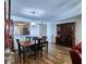Dining room and built in desk area features a grand light fixture and hardwood floors at 6060 Shore S Blvd # 903, Gulfport, FL 33707