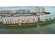 Aerial view of waterfront condo buildings with manicured lawns and palm trees at 6060 Shore S Blvd # 903, Gulfport, FL 33707