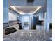 White kitchen features stainless steel appliances, granite countertops and modern finishes at 6060 Shore S Blvd # 903, Gulfport, FL 33707