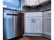 Stainless steel dishwasher paired with white cabinets and stunning granite countertops at 6060 Shore S Blvd # 903, Gulfport, FL 33707