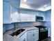 Open concept kitchen boasting stainless appliances, granite countertops, and white cabinets at 6060 Shore S Blvd # 903, Gulfport, FL 33707