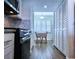 Well-lit kitchen with stainless steel oven and granite countertops at 6060 Shore S Blvd # 903, Gulfport, FL 33707