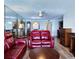 Comfortable living room features a ceiling fan and a mirrored wall at 6060 Shore S Blvd # 903, Gulfport, FL 33707