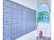 Wall of condominium mailboxes next to artistic mural featuring seaside theme at 6060 Shore S Blvd # 903, Gulfport, FL 33707