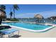 Resort-style pool area with comfortable lounge chairs and waterfront views at 6060 Shore S Blvd # 903, Gulfport, FL 33707