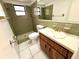Enclosed bathroom with tiled walls and floor at 613 Sandy Hollow Rd, Tarpon Springs, FL 34689