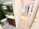 Enclosed bathroom adjacent to bedroom and hallway at 613 Sandy Hollow Rd, Tarpon Springs, FL 34689