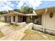 Close-up exterior view with stone accents, featuring a charming front entryway and attached garage at 613 Sandy Hollow Rd, Tarpon Springs, FL 34689