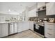 A well-lit kitchen with new stainless steel appliances and seamless flow to living areas at 6433 Werner Ave, New Port Richey, FL 34652