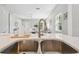 A deep kitchen sink with stainless steel faucet and large windows at 6433 Werner Ave, New Port Richey, FL 34652