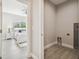 Bedroom view from a utility room with space for a washer and dryer at 6433 Werner Ave, New Port Richey, FL 34652
