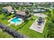Aerial view of community amenities including pool, playground, and lake at 6468 Rubia Cir, Apollo Beach, FL 33572