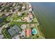 Aerial view of waterfront community with tennis courts and community pool at 6468 Rubia Cir, Apollo Beach, FL 33572
