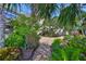 Stone pathway in backyard leading to the rear of the home at 6468 Rubia Cir, Apollo Beach, FL 33572