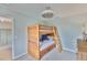 Bright bedroom with a wooden bunkbed and a view into another room at 6468 Rubia Cir, Apollo Beach, FL 33572