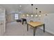 Large game room with a study area, foosball table, comfortable beanbag, and natural light at 6468 Rubia Cir, Apollo Beach, FL 33572