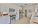 Modern kitchen with stainless steel appliances, white cabinetry, and a functional layout at 6468 Rubia Cir, Apollo Beach, FL 33572