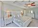 Serene main bedroom featuring a tray ceiling, neutral walls, carpet and white furniture at 6468 Rubia Cir, Apollo Beach, FL 33572