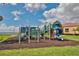 Community playground with swings, slides, and climbing equipment at 6468 Rubia Cir, Apollo Beach, FL 33572