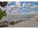 Waterfront view with rope fence next to rocks at 6468 Rubia Cir, Apollo Beach, FL 33572