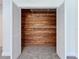 Walk-in closet featuring cedar planking on the back wall and wire shelving for optimal storage solutions at 6602 Winding Brook Dr, New Port Richey, FL 34655
