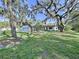 Quaint home nestled amongst large, moss-covered trees offers a serene and private setting at 6602 Winding Brook Dr, New Port Richey, FL 34655