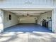 Spacious, clean two-car garage with painted floor at 6602 Winding Brook Dr, New Port Richey, FL 34655
